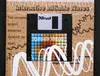 The floppy in its cardboard sleeve: a grid of blue, red and orange squares on the label, white painted waves, and the line The complex system becomes dynamic by itself
