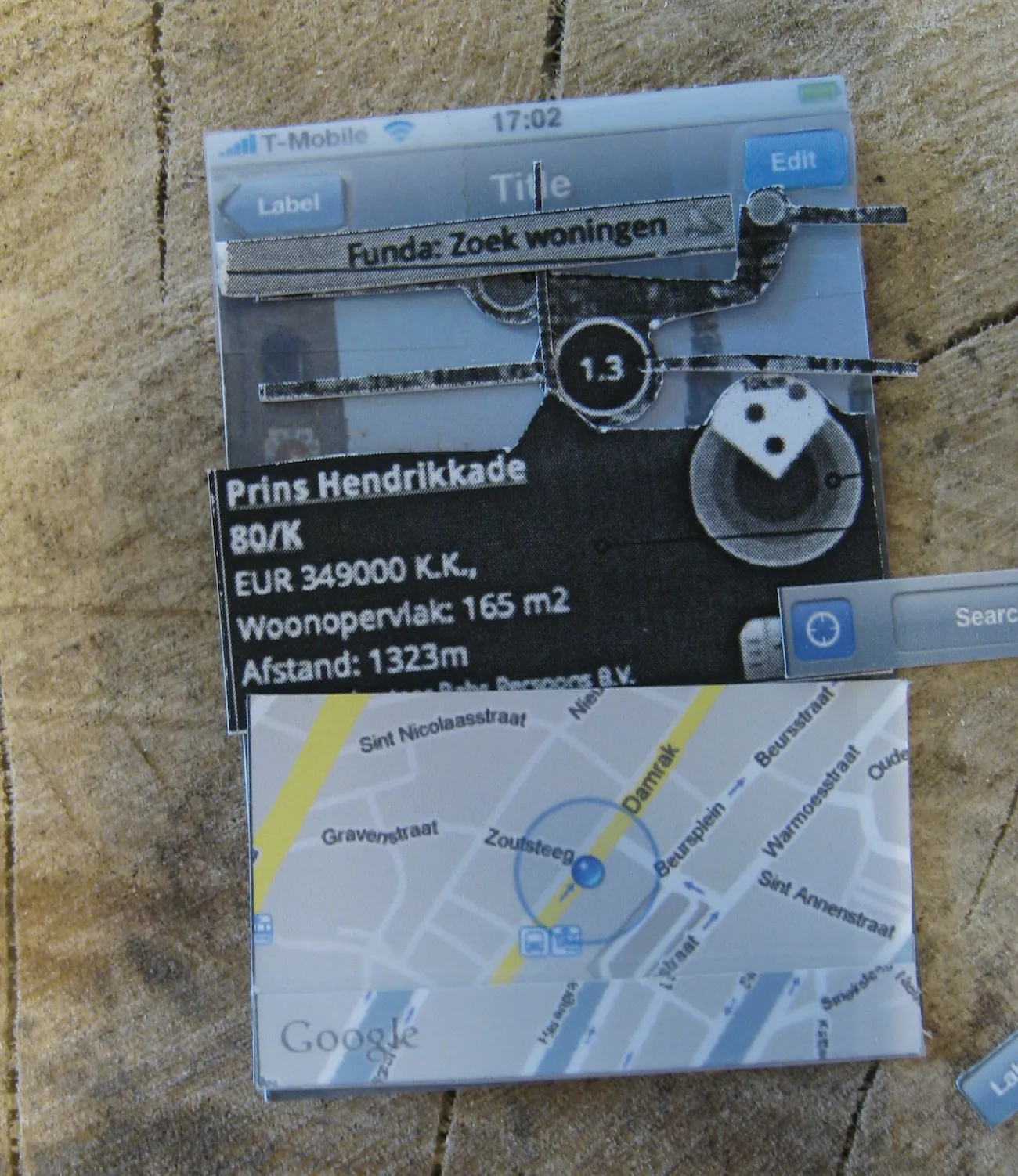 Close-up of the paper prototype: a cut-out Funda listing for Prins Hendrikkade over a camera view, a Google map folded out below